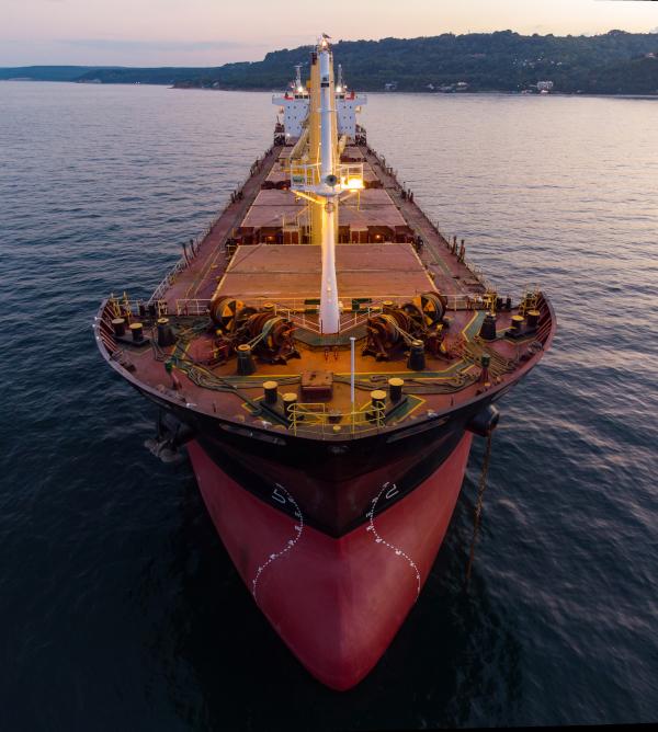 Birds-eye view of freight ship on the water.